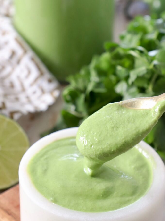 cilantro lime sauce on spoon in bowl