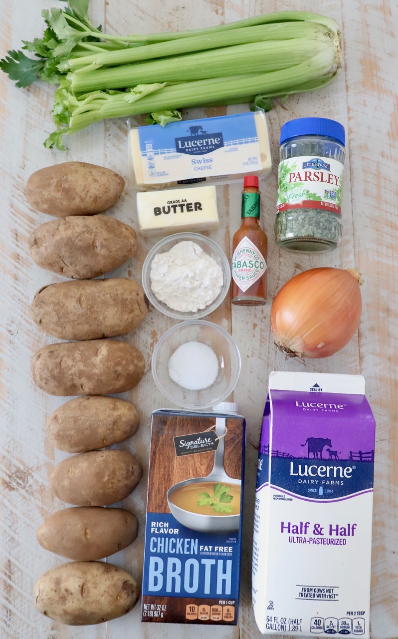potato soup ingredients on white wood board