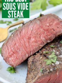 sous vide steak sliced in half on plate with fork