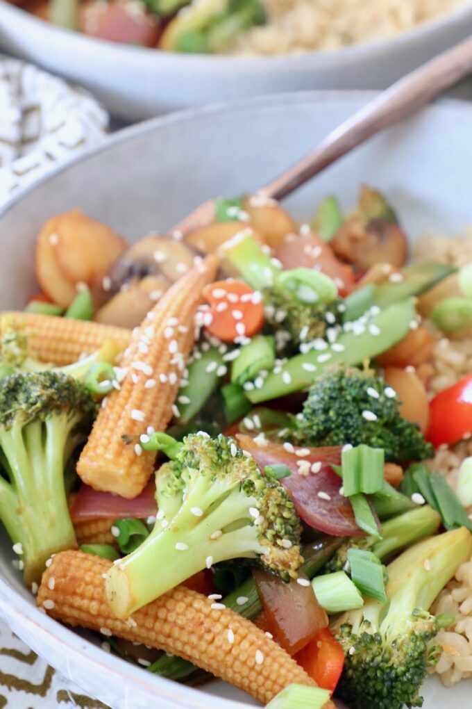 stir fry vegetables in bowl with fork