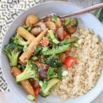 stir fry vegetables in bowl with rice and fork