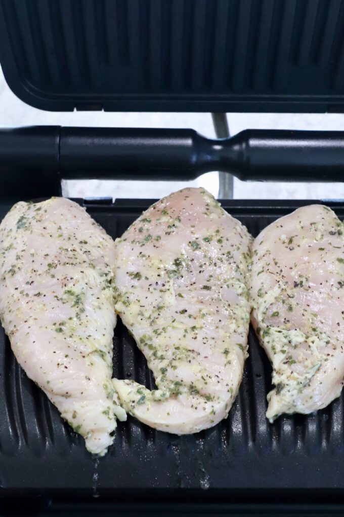 marinated chicken breasts in an indoor grill