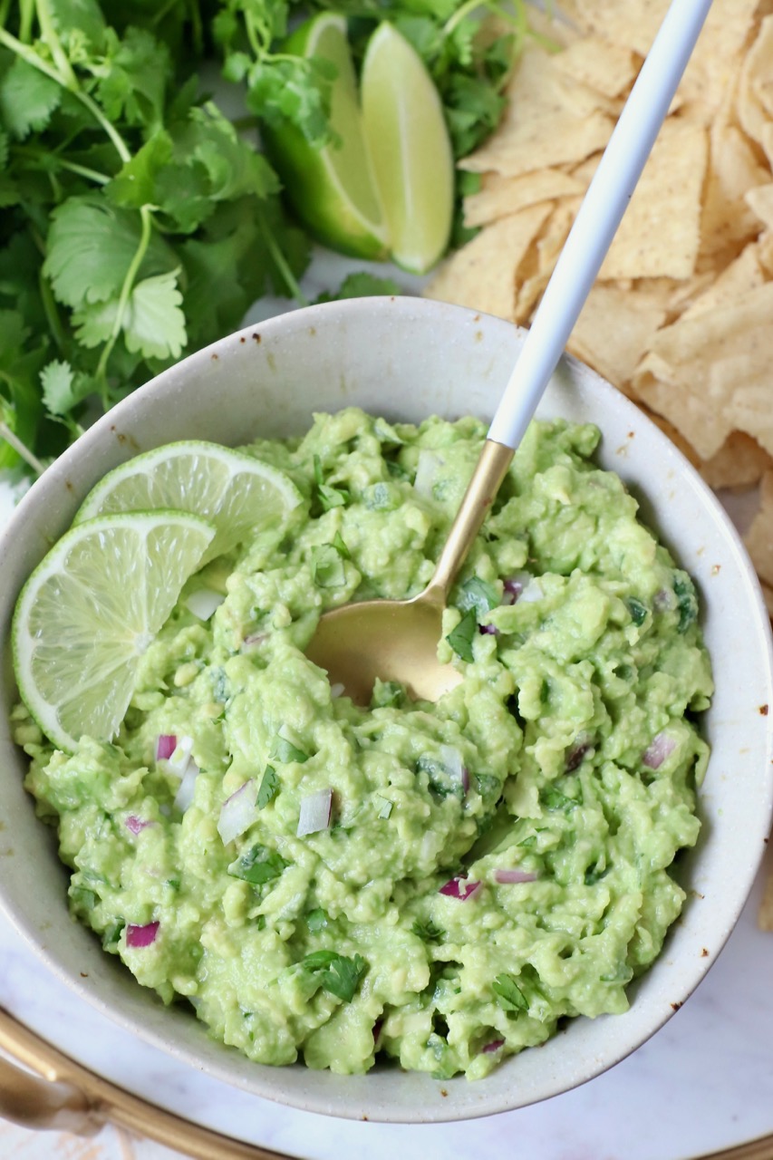 guacamole in bowl with spoon