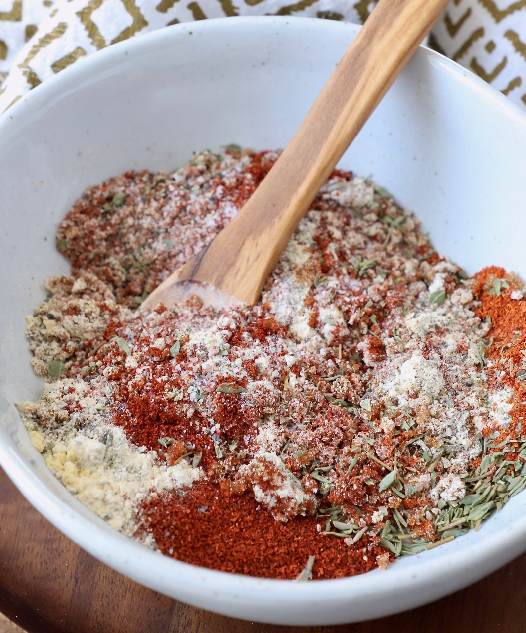 pork chop seasoning blend in bowl with wooden spoon