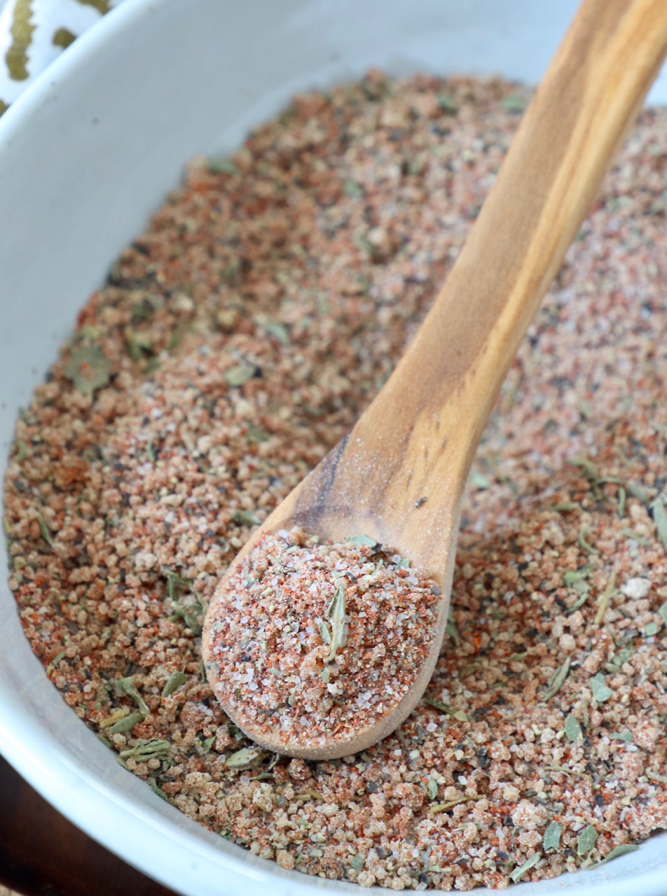 pork chop seasoning in bowl with wood spoon