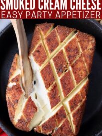 smoked seasoned cream cheese in skillet with wood serving spoon