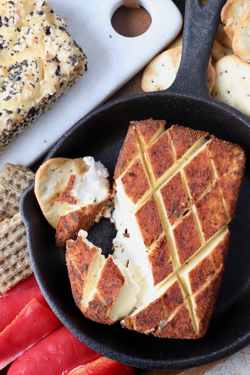 smoked seasoned cream cheese in cast iron skillet with crackers