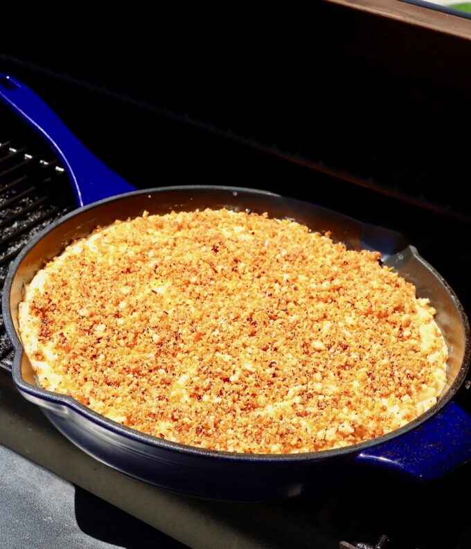skillet of mac and cheese in smoker