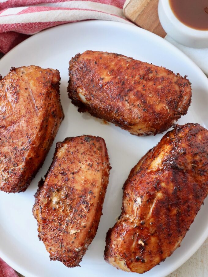 smoked pork chops on round white plate