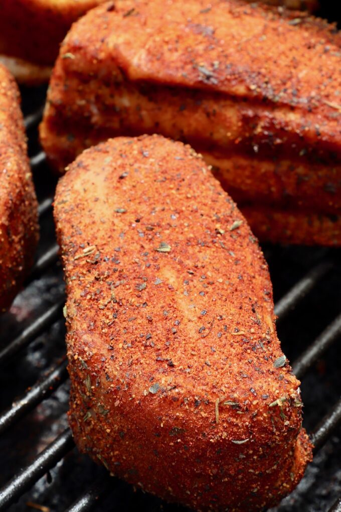 seasoned pork chops on a smoker