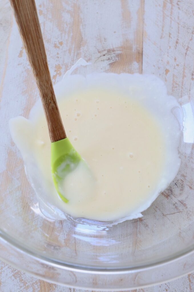 honey and mayonnaise combined in bowl with spatula