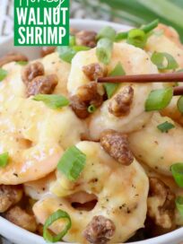 cooked shrimp in honey sauce with candied walnuts and diced green onions