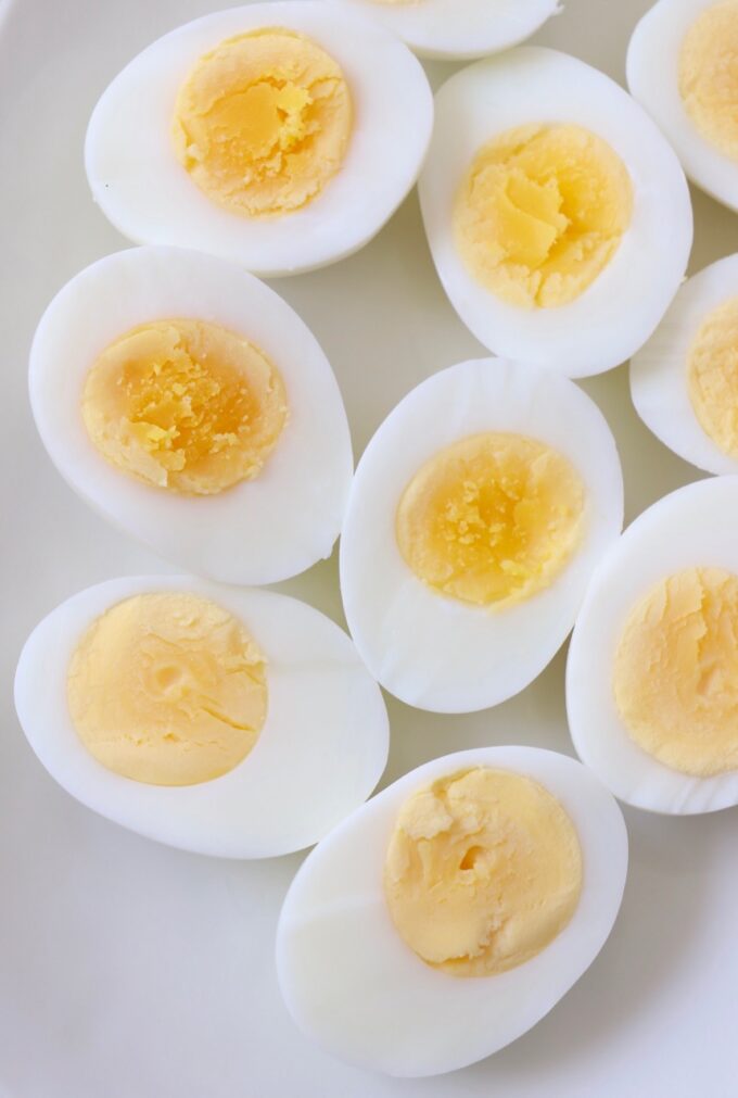 hard boiled eggs cut in half on plate
