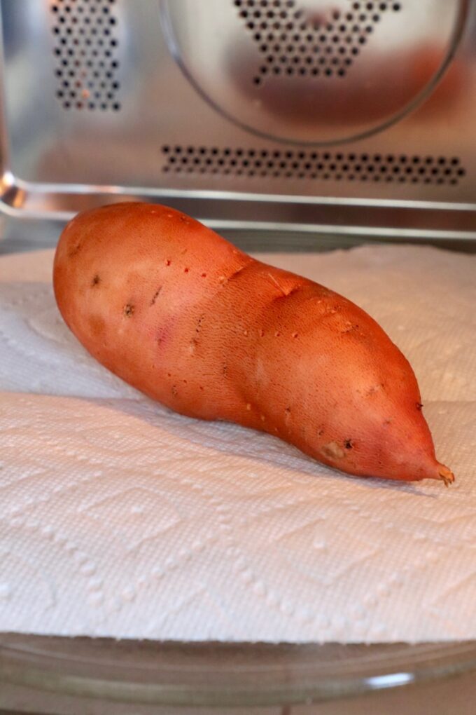 sweet potato in microwave on paper towel
