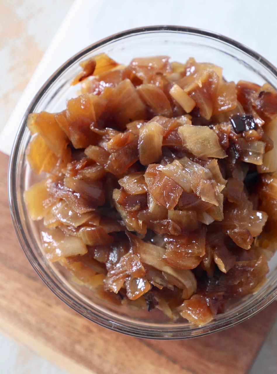 diced caramelized onions in small glass bowl