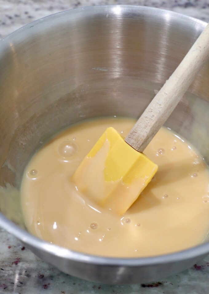 condensed milk in bowl mixed with vanilla extract