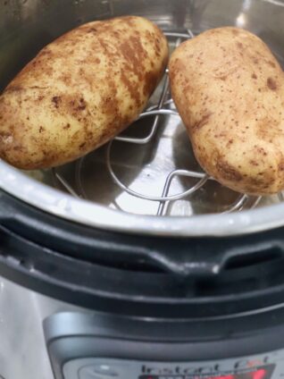 two cooked potatoes in Instant Pot