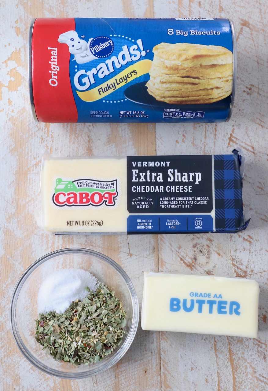 ingredients for cheesy pull apart rolls on wood board