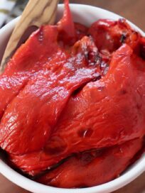 roasted red peppers in white bowl