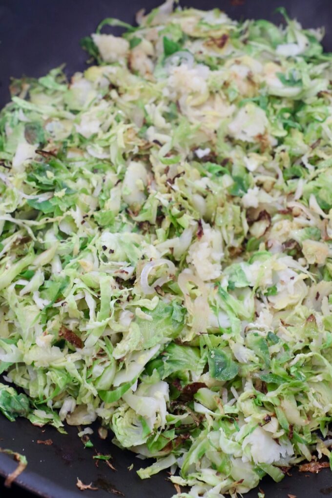 cooked shredded brussels sprouts in skillet
