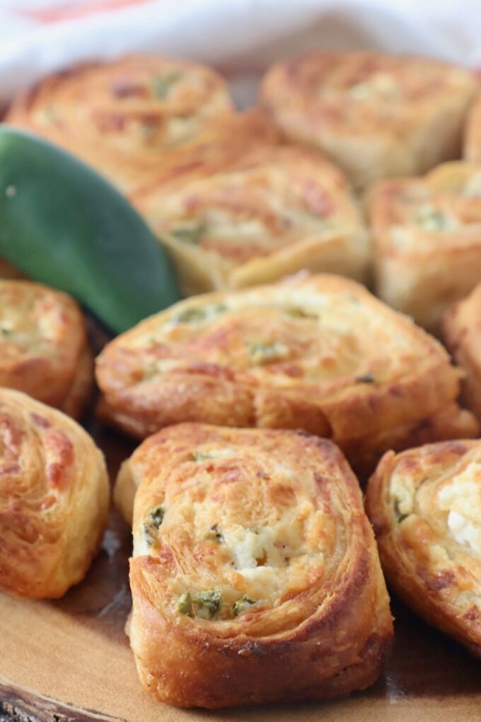 jalapeno popper crescent rolls on wood serving board