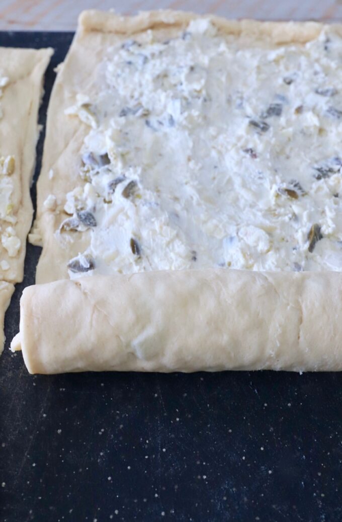 crescent roll dough, rolled up over cream cheese filling