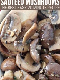 sauteed mushrooms with garlic in bowl with wooden spoon