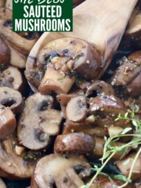 sauteed mushrooms in skillet with wooden spoon and fresh thyme sprigs