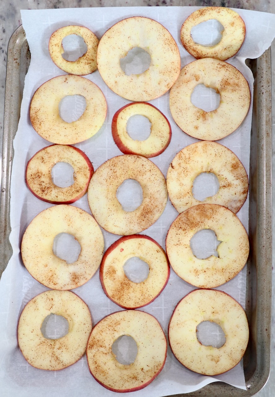 apple slices on parchment lined baking sheet