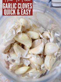 peeled garlic cloves in glass jar