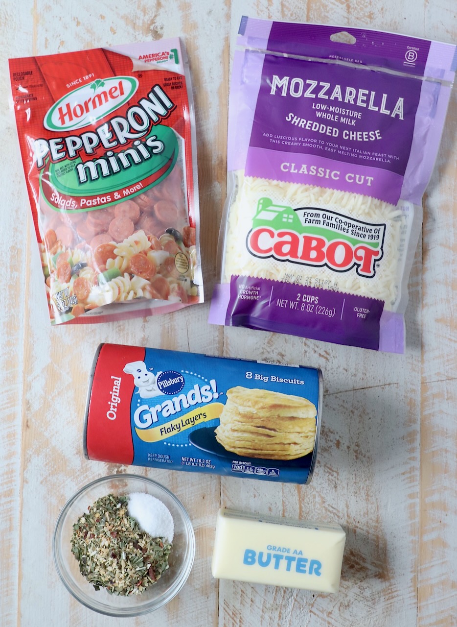 ingredients for pizza rolls on wood board
