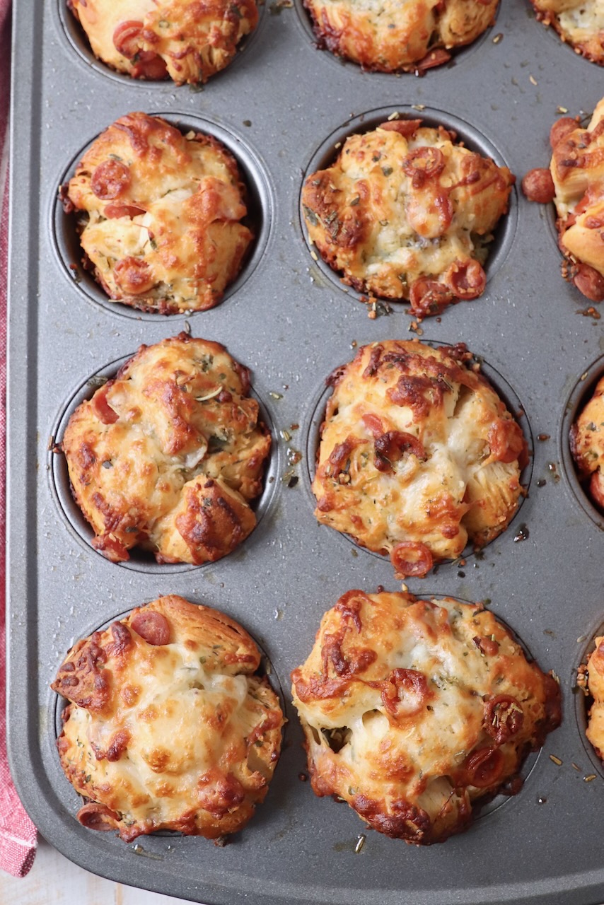 baked pizza rolls in muffin tin