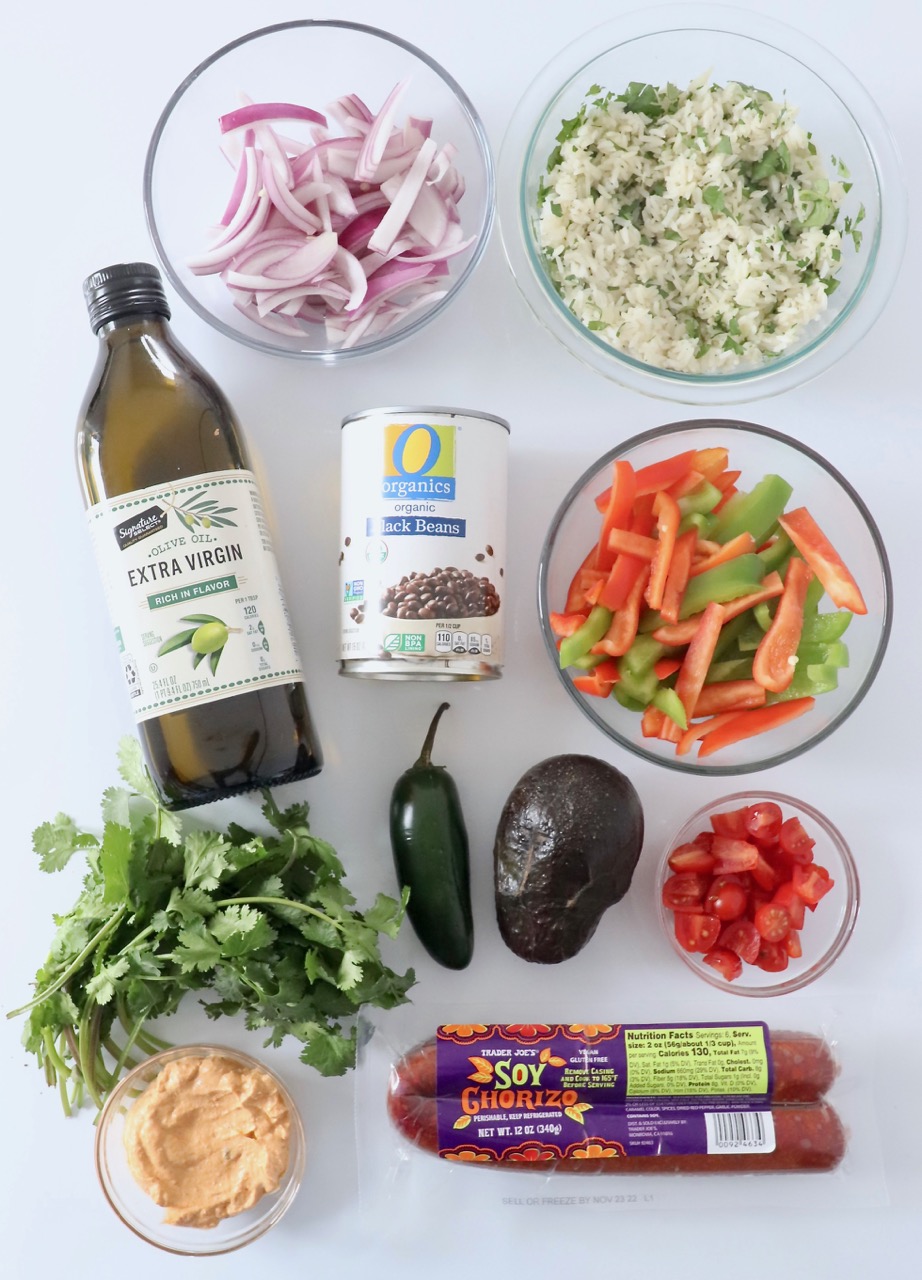 ingredients for vegetarian burrito bowl on white background