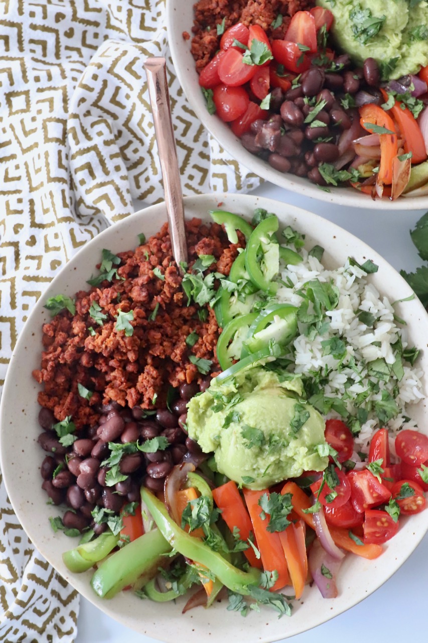 bowls filled with soyrizo, beans, rice and vegetables