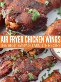 cooked air fryer chicken wings tossed with buffalo sauce on plate