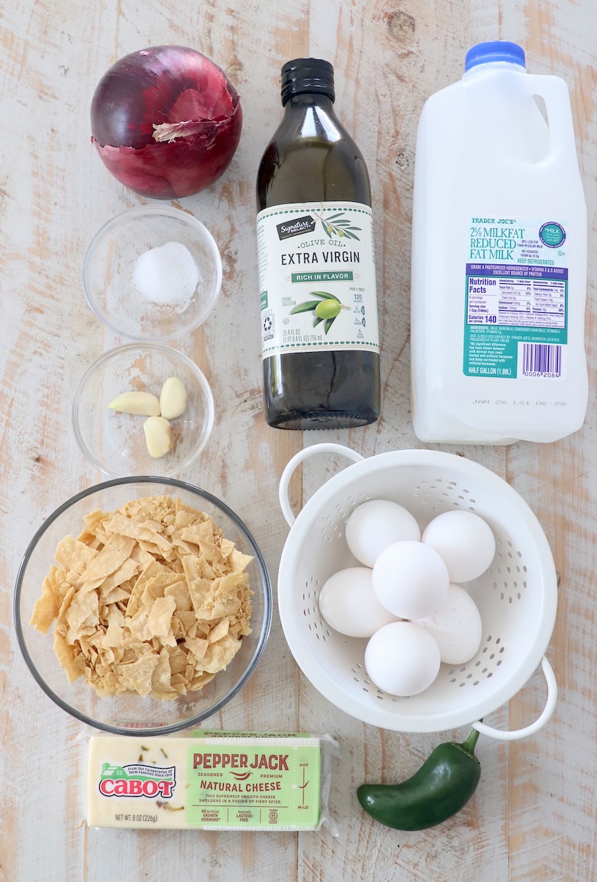 ingredients for migas on white wood cutting board