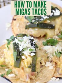 migas tacos on plate topped with roasted poblano peppers