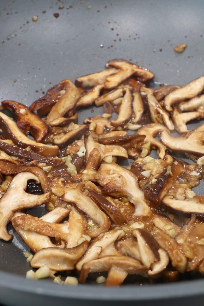 cooked shittake mushrooms in wok