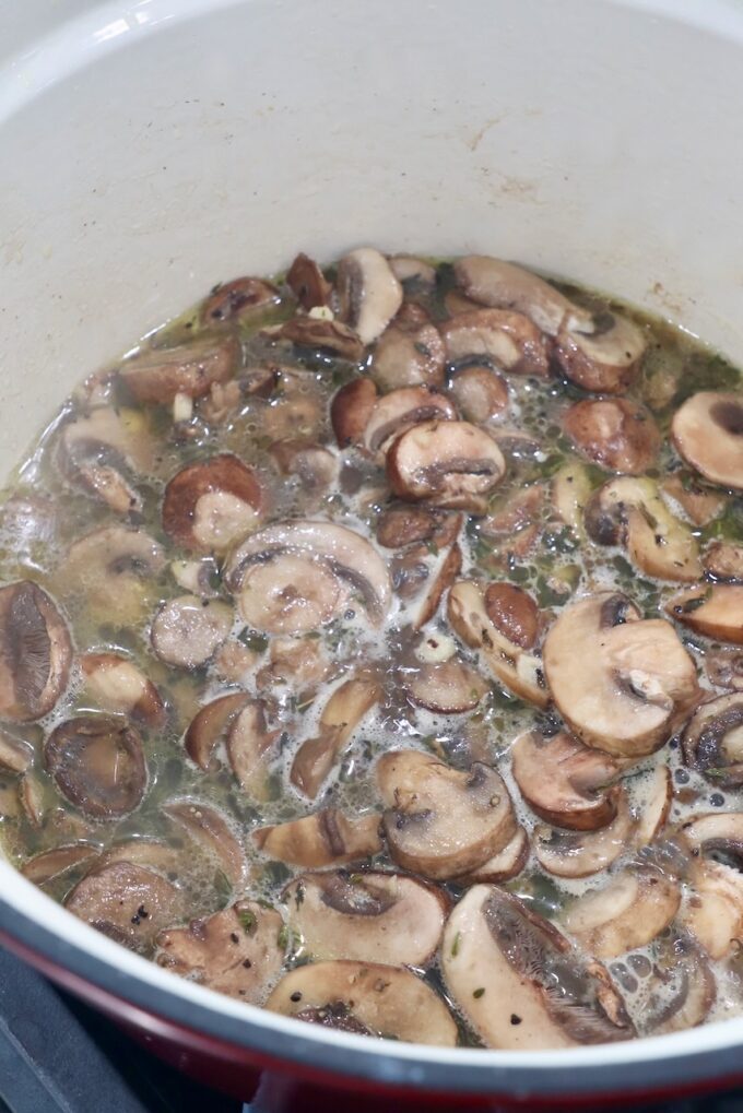 sliced mushrooms with liquid in pot