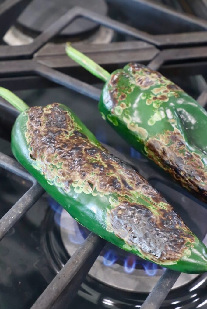 roasted poblano peppers on gas stovetop