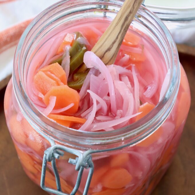 pickled onions, carrots and jalapenos in large glass mason jar