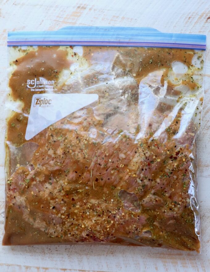 skirt steak in marinade in large zipper bag