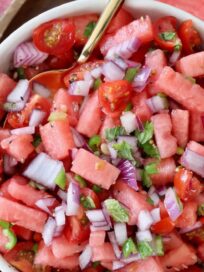 prepared watermelon salsa in bowl with spoon