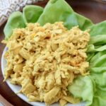 coronation chicken on plate with leaves of lettuce