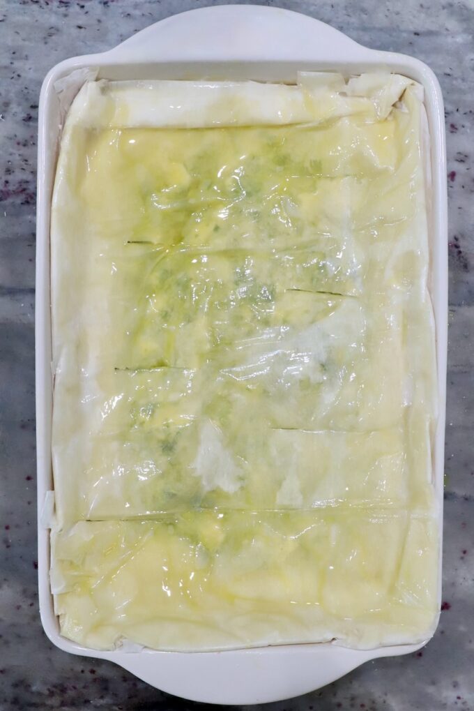 unbaked zucchini pie with phyllo crust in rectangle baking dish