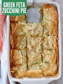 baked zucchini pie with phyllo crust in baking dish with silver pie server
