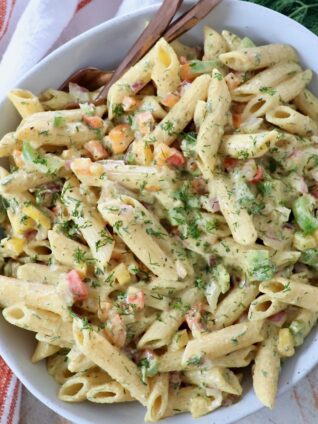prepared pasta salad in bowl with forks