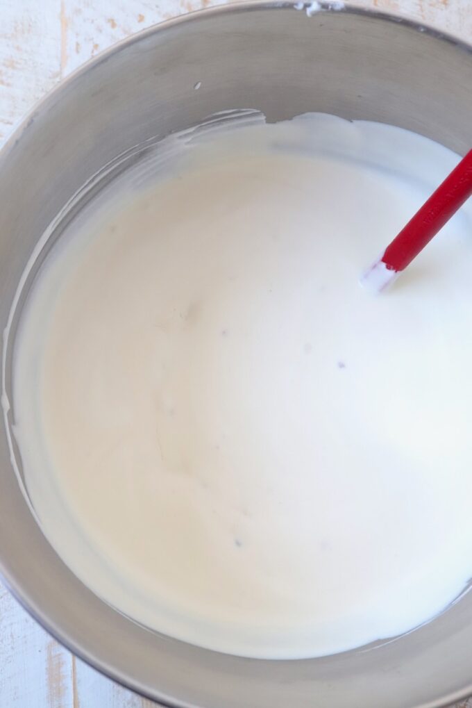 maple bacon ice cream base in mixing bowl with spatula