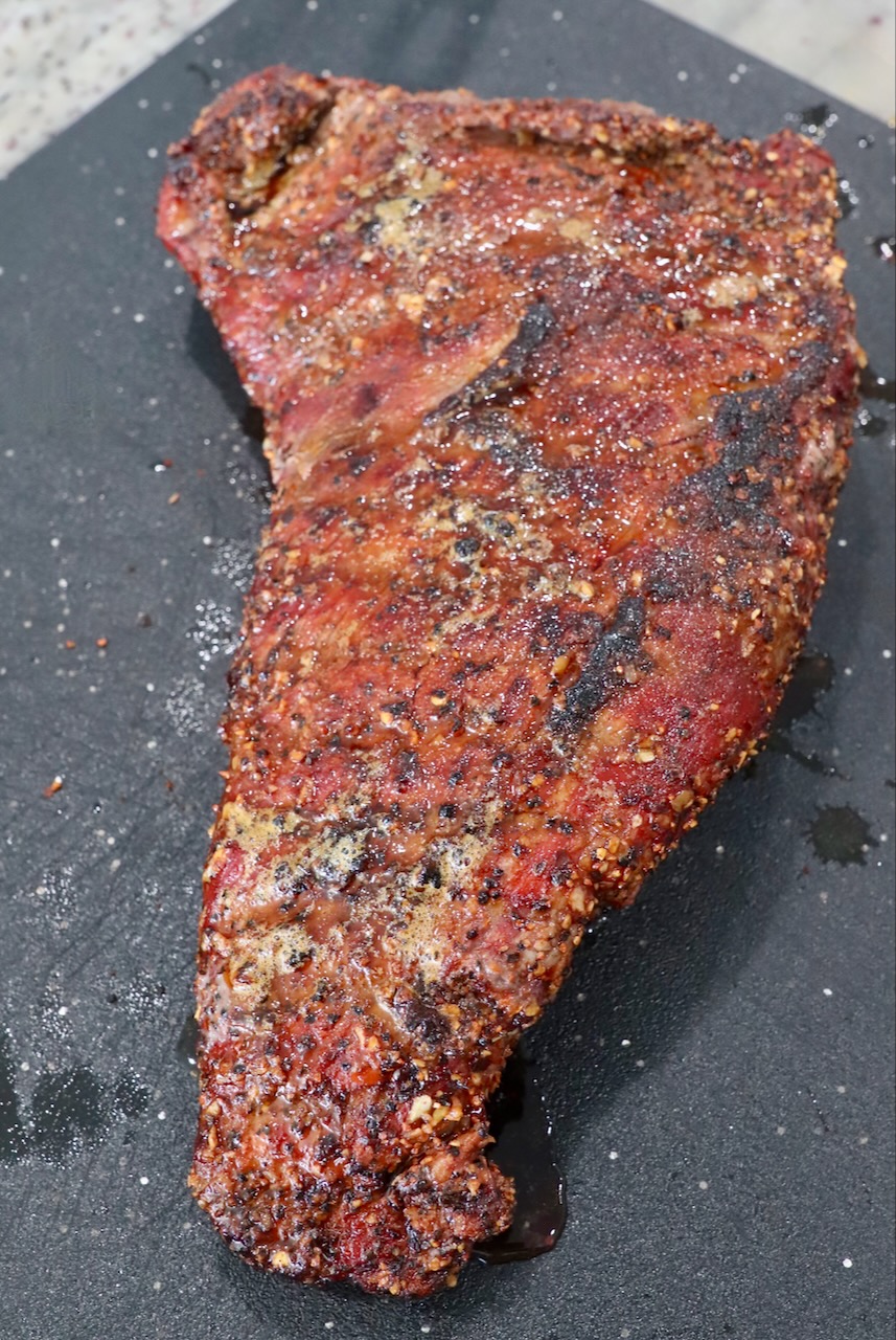 smoked, seared tri tip roast on cutting board