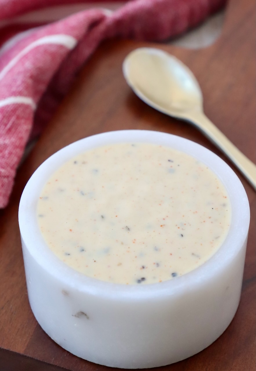 white bbq sauce in small white bowl